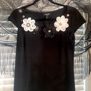 Gorgeous black dress with beautiful flowered neckline.